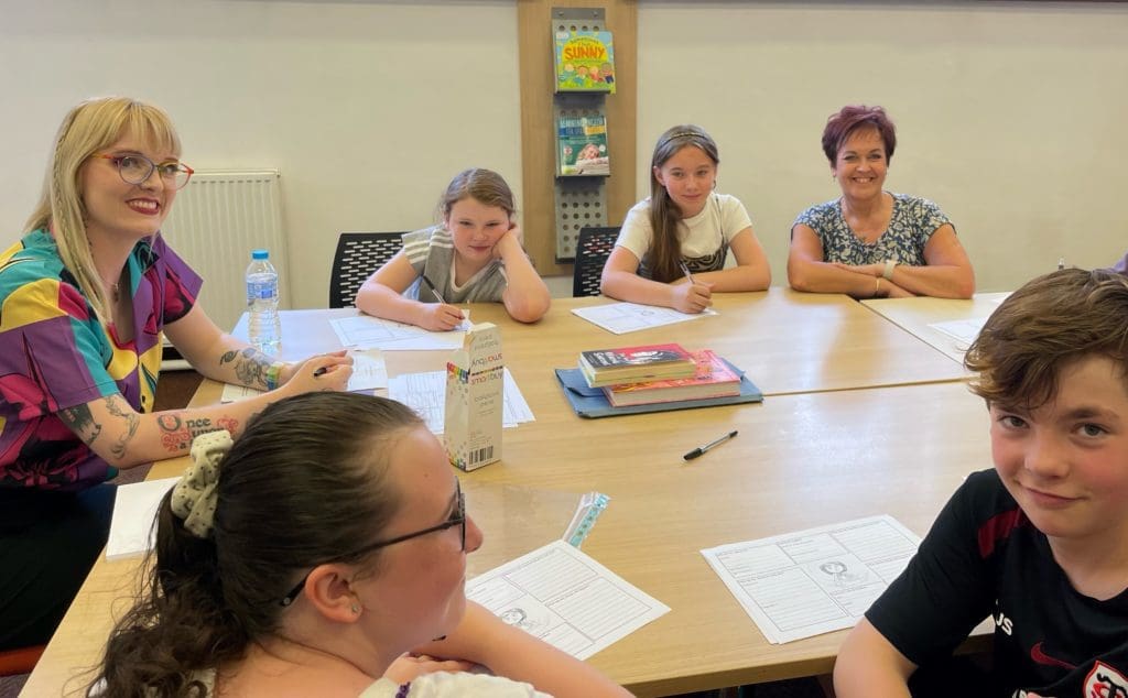 Deputy Minister joins children for creative writing as part of summer activities