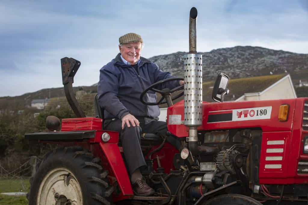 Farmer Owen John, 91, back on his tractor after “miraculous” robotic surgery