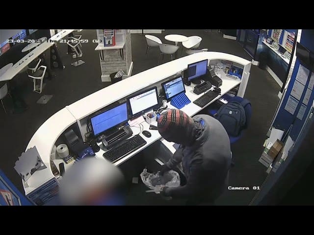 Watch as armed robber enters betting shop in Merthyr Tydfil