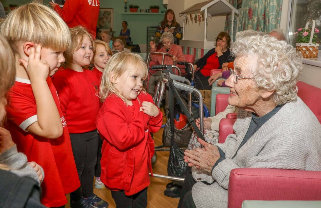 Tears of joy as two generations sing Christmas carols together