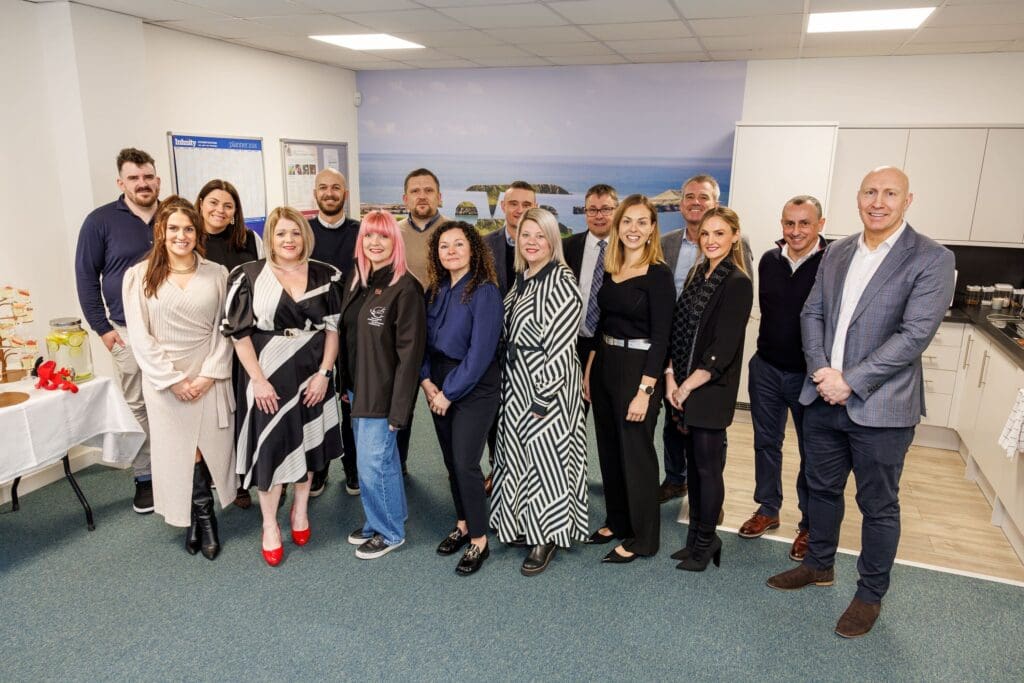 Howden official Swansea office opening flanked by rugby star