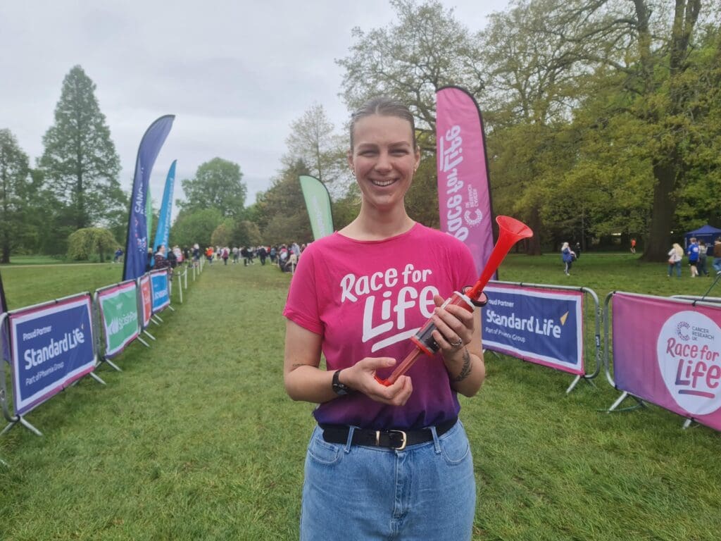 Cancer survivor, Georgina, sounds the horn to start Race for Life Cardiff