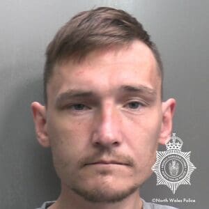 Man who spat in officer’s face jailed