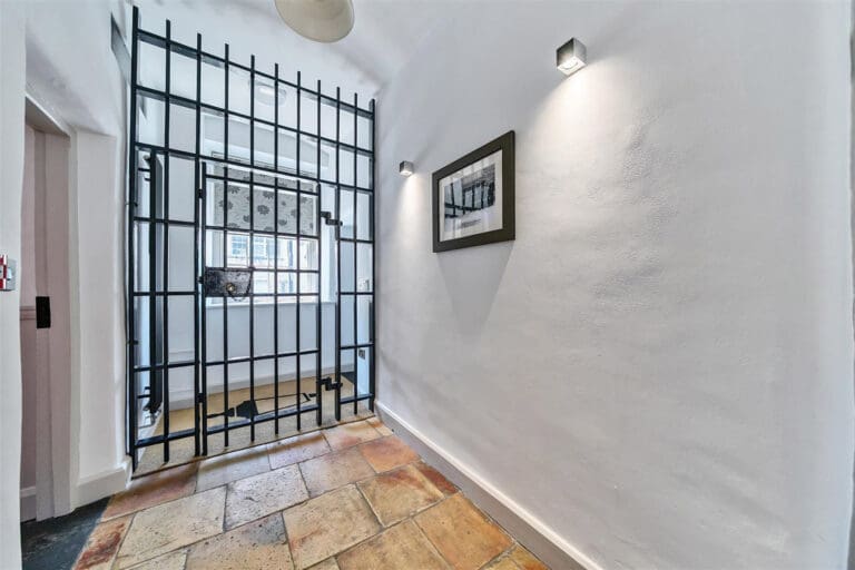 Former police station with cells and courtyard hot tub hits the market