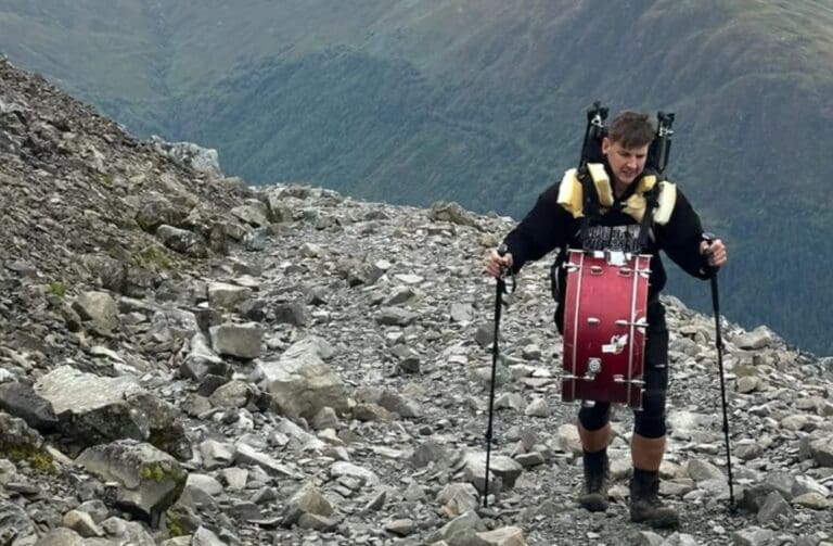 Musician carries drum kit to summit of Snowdon for men’s mental health
