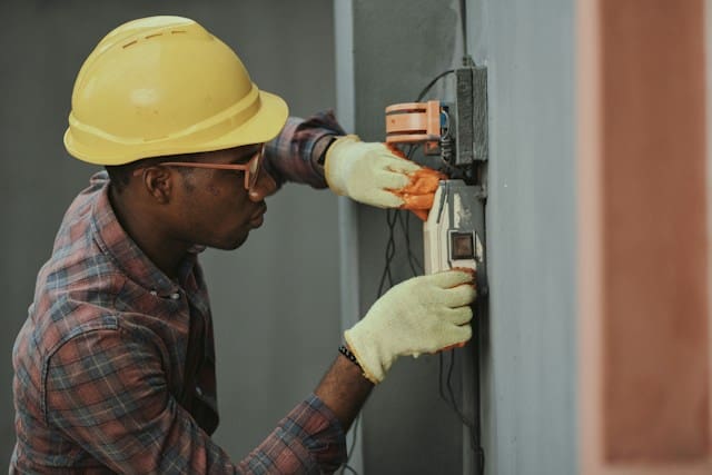 Launching a PAT Testing Business In the UK A technician testing an electrical appliance with a PAT testing machine