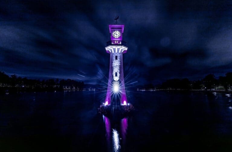 Cardiff landmarks light up purple for City Hospice appeal Roath Park lit up in purple at night for City Hospice's Light up a Life appeal