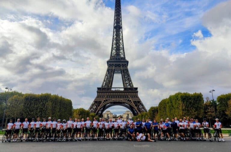 Cyclists raise £100,000 for Cardiff hospice after epic ride to Paris Cyclists at the Eiffel Tower after Cardiff to Paris challenge for City Hospice