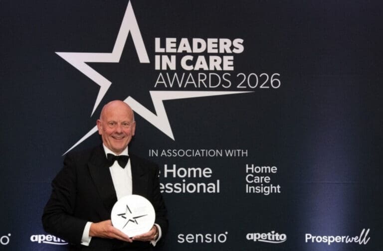 Mario Kreft MBE holding his Lifetime Achievement Award at the Leaders in Care Awards