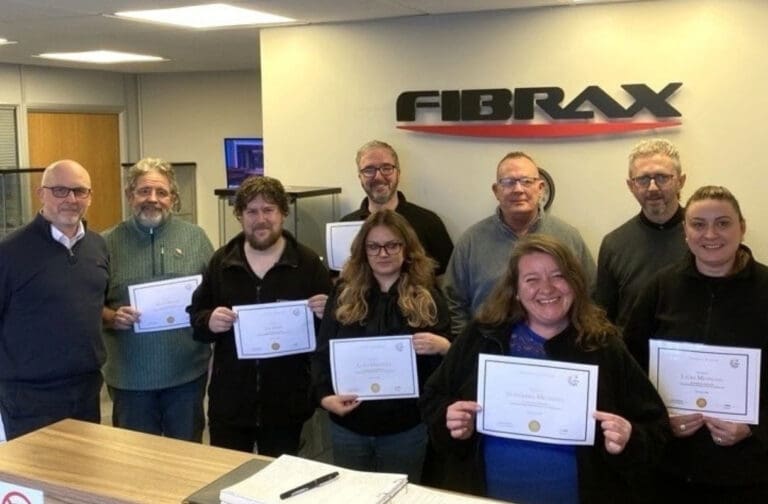 Welsh businesses offered fully subsidised staff training Fibrax staff holding certificates after a menopause awareness course with Coleg Cambria